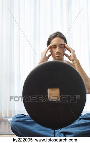 Man massaging his temple View Large Photo Image Stock Photography - Man massaging his temple. Fotosearch