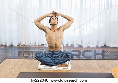 Man practicing yoga View Large Photo Image Stock Photograph - Man practicing yoga. Fotosearch