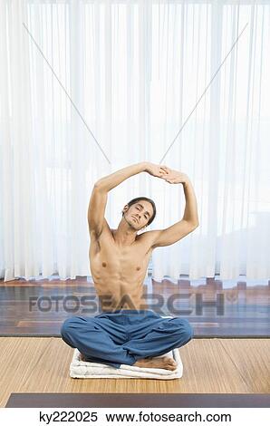 Man practicing yoga View Large Photo Image Stock Photography - Man practicing yoga. Fotosearch