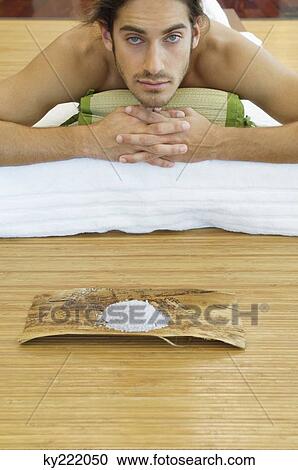 Stock Image - Man receiving spa treatment. Fotosearch