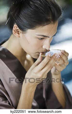 Woman smelling bath salt View Large Photo Image Stock Image - Woman smelling bath salt. Fotosearch
