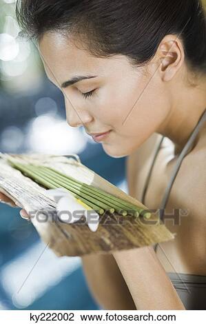 Woman smelling incenses View Large Photo Image Stock Image - Woman smelling incenses. Fotosearch