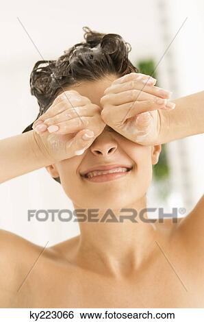 Close-up of a woman covering eyes with her hands View Large Photo Image Stock Photograph - Close-up of a woman covering eyes with her hands. Fotosearch
