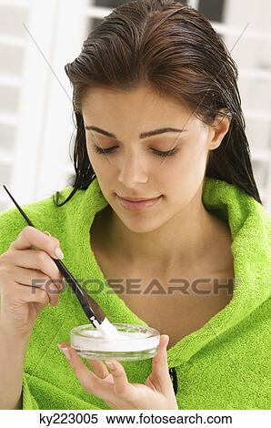 Close-up of a woman mixing hair color View Large Photo Image Stock Photography - Close-up of a woman mixing hair color. Fotosearch