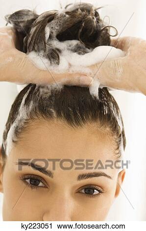 Close-up of a woman shampooing her hair View Large Photo Image Stock Image - Close-up of a woman shampooing her hair. Fotosearch