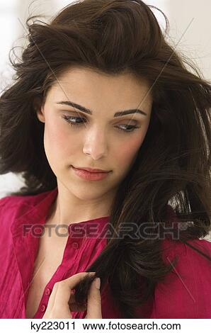Stock Image - Close-up of a woman thinking. Fotosearch