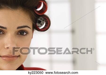 Portrait of a woman with hair curlers in her hair View Large Photo Image Stock Image - Portrait of a woman with hair curlers in her hair. Fotosearch