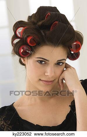 Portrait of a woman with hair curlers in her hair View Large Photo Image Stock Image - Portrait of a woman with hair curlers in her hair. Fotosearch