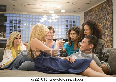 Friends enjoying a party View Large Photo Image Stock Photography - Friends enjoying a party. Fotosearch
