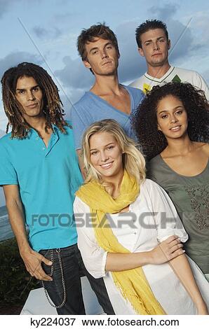 Portrait of five friends standing on the beach View Large Photo Image Stock Photo - Portrait of five friends standing on the beach. Fotosearch