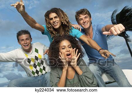 Portrait of four friends looking cheerful View Large Photo Image Picture - Portrait of four friends looking cheerful. Fotosearch