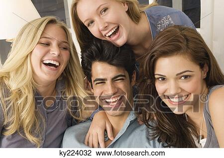 Stock Image - Portrait of four friends smiling. Fotosearch