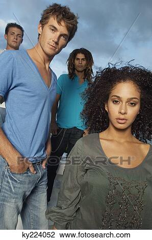 Portrait of four friends standing together View Large Photo Image Stock Image - Portrait of four friends standing together. Fotosearch