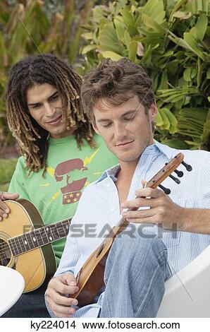 Two men playing guitars View Large Photo Image Picture - Two men playing guitars. Fotosearch