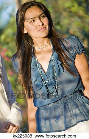 Close-up of a woman thinking View Large Photo Image Stock Photo - Close-up of a woman thinking. Fotosearch