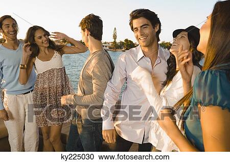 Stock Image - Friends having fun on vacation. Fotosearch