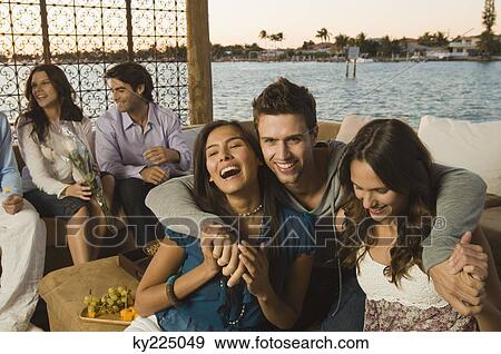 Friends having fun on vacation View Large Photo Image Stock Photo - Friends having fun on vacation. Fotosearch