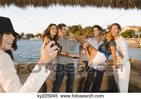 Stock Photography - Friends having fun on vacation. Fotosearch