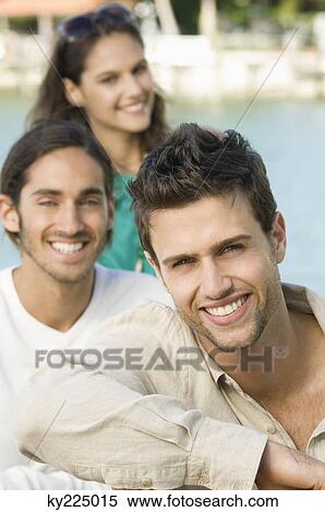 Portrait of three friends smiling View Large Photo Image Stock Photography - Portrait of three friends smiling. Fotosearch