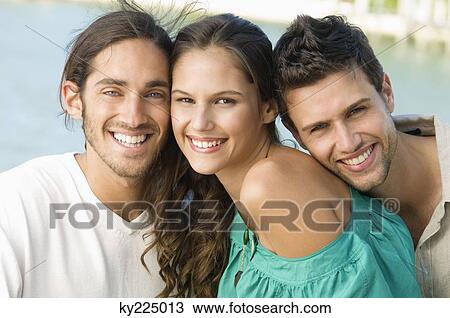 Three friends smiling View Large Photo Image Stock Image - Three friends smiling. Fotosearch