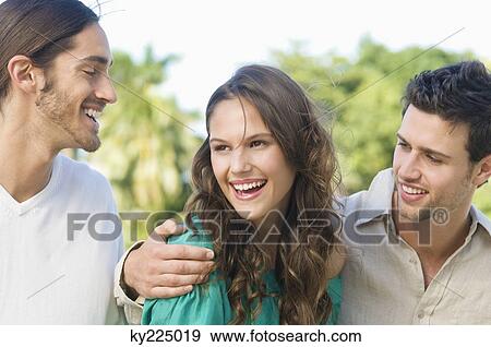 Stock Photo - Three friends smiling. Fotosearch