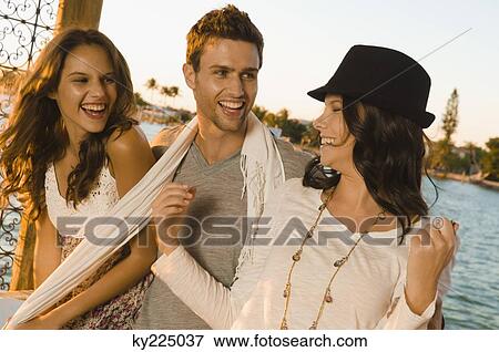 Three friends smiling View Large Photo Image Stock Photo - Three friends smiling. Fotosearch