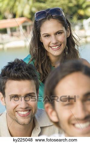 Stock Photo - Three friends smiling. Fotosearch