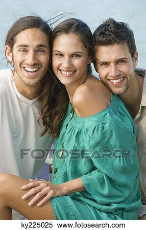 Three friends smiling View Large Photo Image Stock Photography - Three friends smiling. Fotosearch