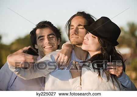Three friends taking a picture of themselves View Large Photo Image Stock Photo - Three friends taking a picture of themselves. Fotosearch