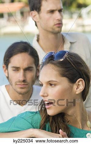Woman with her friends behind her View Large Photo Image Picture - Woman with her friends behind her. Fotosearch