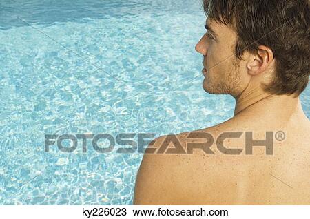 Close-up of a man at the poolside View Large Photo Image Stock Image - Close-up of a man at the poolside. Fotosearch