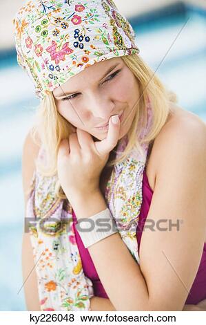 Close-up of a woman with finger on lips View Large Photo Image Stock Photo - Close-up of a woman with finger on lips. Fotosearch