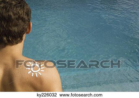 Man with sun shape on his shoulder at the poolside View Large Photo Image Stock Image - Man with sun shape on his shoulder at the poolside. Fotosearch