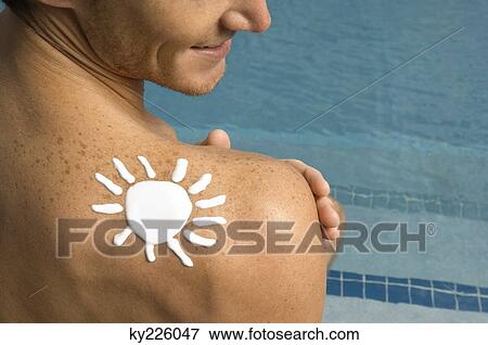 Man with sun shape on his shoulder at the poolside View Large Photo Image Stock Photo - Man with sun shape on his shoulder at the poolside. Fotosearch