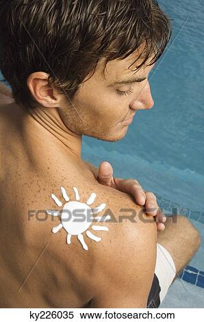 Man with sun shape on his shoulder at the poolside View Large Photo Image Stock Photography - Man with sun shape on his shoulder at the poolside. Fotosearch