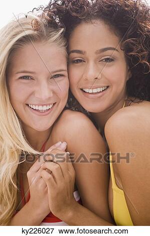 Portrait of two friends smiling View Large Photo Image Stock Photo - Portrait of two friends smiling. Fotosearch