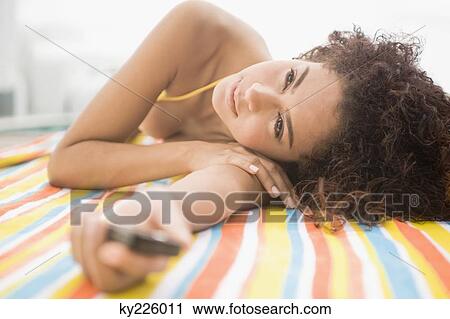 Woman day dreaming at the poolside View Large Photo Image Stock Image - Woman day dreaming at the poolside. Fotosearch