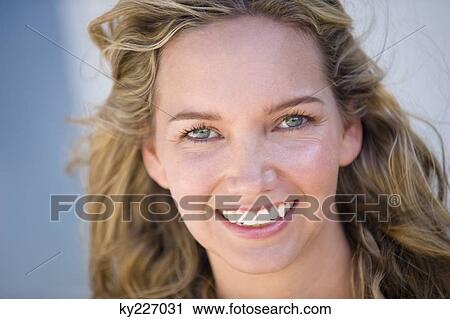 Stock Image - Portrait of a woman smiling. Fotosearch