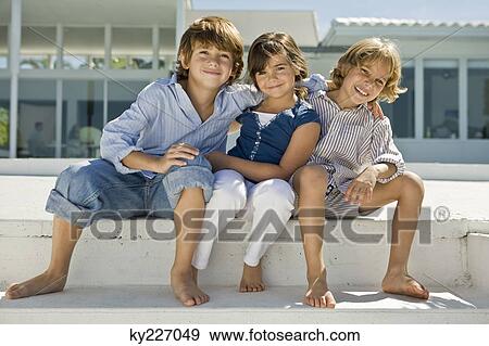 Portrait of three children sitting together View Large Photo Image Stock Photo - Portrait of three children sitting together. Fotosearch