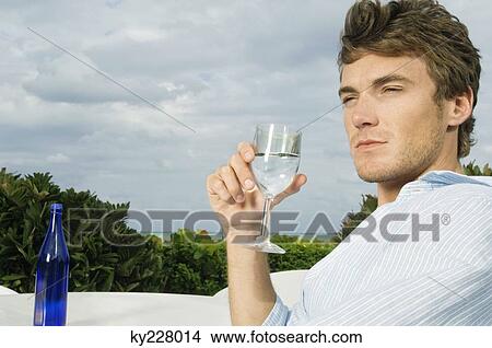 Close-up of a man drinking water View Large Photo Image Picture - Close-up of a man drinking water. Fotosearch