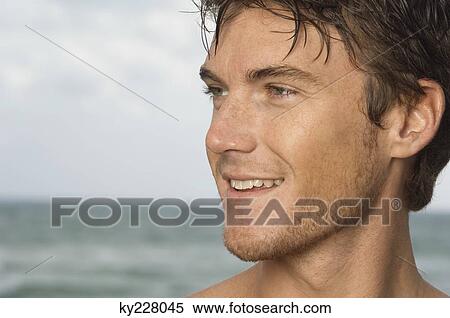 Close-up of a man smiling View Large Photo Image Stock Photography - Close-up of a man smiling. Fotosearch