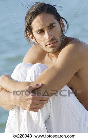 Close-up of a man thinking View Large Photo Image Stock Image - Close-up of a man thinking. Fotosearch