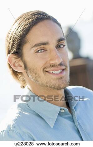 Portrait of a man smiling View Large Photo Image Stock Photo - Portrait of a man smiling. Fotosearch