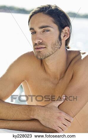 Stock Image - Portrait of a man thinking. Fotosearch