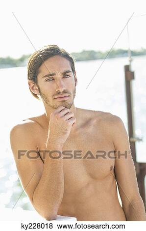 Portrait of a man thinking View Large Photo Image Stock Photo - Portrait of a man thinking. Fotosearch