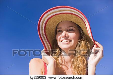 Close-up of a woman smiling View Large Photo Image Stock Image - Close-up of a woman smiling. Fotosearch