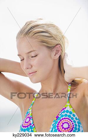 Close-up of a woman with her eyes closed View Large Photo Image Picture - Close-up of a woman with her eyes closed. Fotosearch