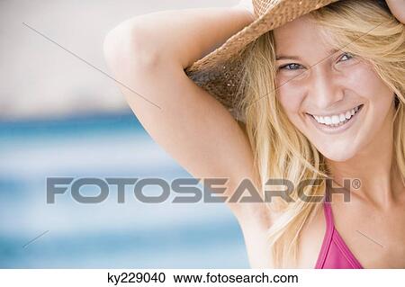 Stock Image - Portrait of a woman smiling. Fotosearch
