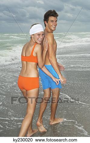 Couple on the beach View Large Photo Image Stock Image - Couple on the beach. Fotosearch