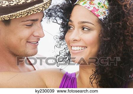 Stock Photo - Couple smiling at each other. Fotosearch